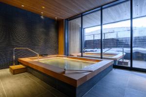Postel nebo postele na pokoji v ubytování Yu Kiroro, Ski-in Ski-out Luxury Residences