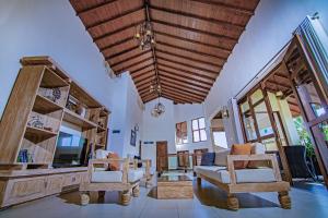a living room with two chairs and a couch at Rivora Residence in Kandy