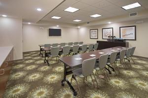 a conference room with a long table and chairs at Staybridge Suites Denver South - Highlands Ranch by IHG in Littleton +31 photos