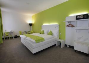 Postel nebo postele na pokoji v ubytování Hotel City Inn Basel