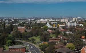 a view of a city with a bridge in the distance at Fiori Apartments in Sydney