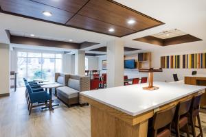 an office with a lobby with a bar and chairs at Holiday Inn Express & Suites Bremen GA by IHG in Bremen