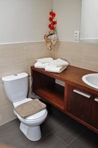 a bathroom with a toilet and a sink at Glass House Kosice in Košice