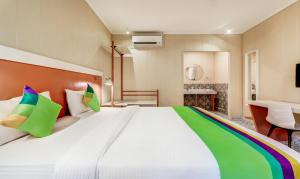 Treebo Sava Resort with Pool客房内的一张或多张床位