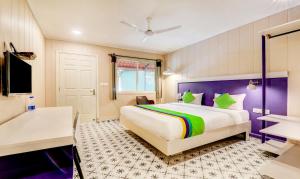 Treebo Sava Resort with Pool客房内的一张或多张床位