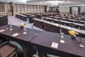 a large room filled with tables and chairs at Crowne Plaza Seattle Airport, an IHG Hotel in SeaTac