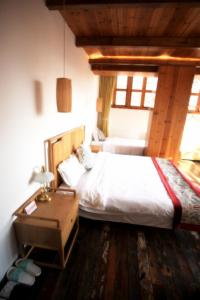 Tongli Begonia Flowers Guesthouse客房内的一张或多张床位