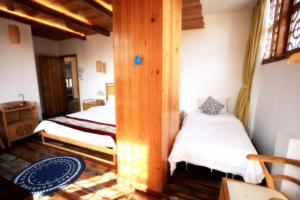 Tongli Begonia Flowers Guesthouse客房内的一张或多张床位