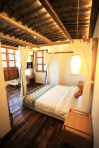 Tongli Begonia Flowers Guesthouse客房内的一张或多张床位