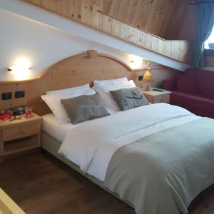Säng eller sängar i ett rum på Hotel Vallechiara