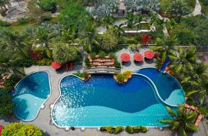 an overhead view of a swimming pool at a resort at Ancasa Residences, Port Dickson by Ancasa Hotels & Resorts in Port Dickson