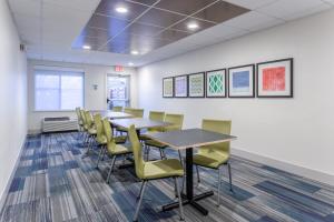 a conference room with tables and chairs at Holiday Inn Express Scottsburg by IHG in Scottsburg +36 photos