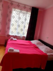 Katil atau katil-katil dalam bilik di Red Stone Guest House