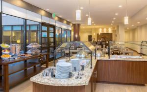 a restaurant with a buffet line with dishes at Staybridge Suites Seattle - Fremont by IHG in Seattle
