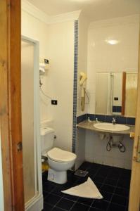 a bathroom with a toilet and a sink at Logaina Sharm Resort Apartments in Sharm El Sheikh