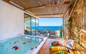 an indoor pool with a view of the ocean at Mandalina Suites in Kaş