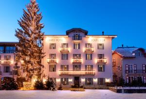 a christmas tree in front of a hotel at Grand Hotel Soleil d'Or in Megève
