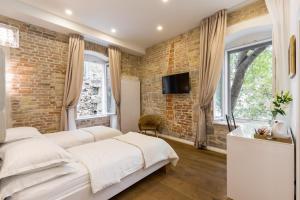 Posteľ alebo postele v izbe v ubytovaní Pellegrini Luxury Rooms