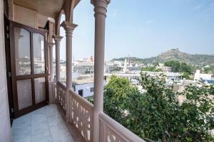 a balcony with a view of a city at Jashoda Mystic Haveli in Pushkar