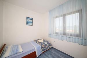 Postel nebo postele na pokoji v ubytování Holiday home Sego