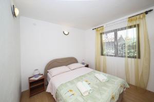 Postel nebo postele na pokoji v ubytování Holiday home Sego