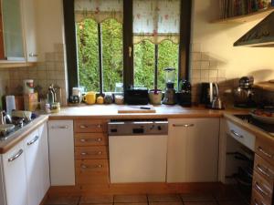 a kitchen with a sink and a counter top at Petra Maria Sölle - Ferienhaus sehr privat in Presseggersee