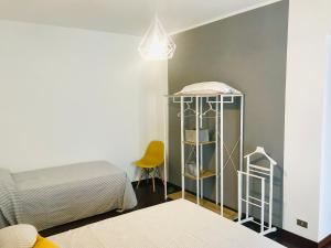 A bed or beds in a room at Genova Suite Art
