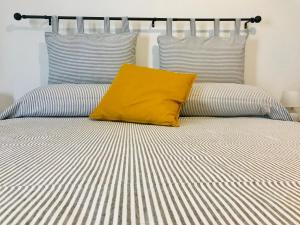 A bed or beds in a room at Genova Suite Art