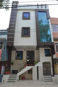 a house with a staircase in front of it at Benda Rejuvenate Hotel in Jodhpur
