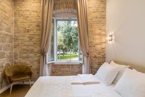 Posteľ alebo postele v izbe v ubytovaní Pellegrini Luxury Rooms