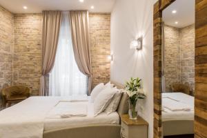 Posteľ alebo postele v izbe v ubytovaní Pellegrini Luxury Rooms