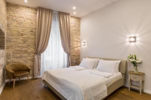 Posteľ alebo postele v izbe v ubytovaní Pellegrini Luxury Rooms