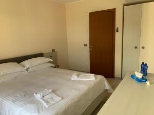 Posteľ alebo postele v izbe v ubytovaní Albergo Parco Gran Sasso