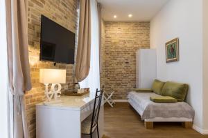 Posedenie v ubytovaní Pellegrini Luxury Rooms