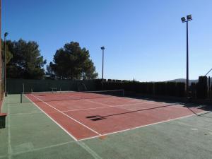 a tennis court with a net on top of it at Finca Mirador in Macastre
