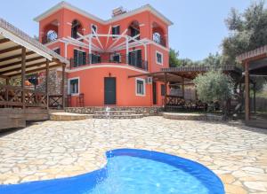 a house with a swimming pool in front of it at Villa Anna in Athani