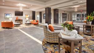 a lobby of a hotel with couches and chairs at Candlewood Suites Kearney, an IHG Hotel in Kearney