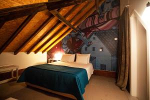 Uma cama ou camas num quarto em Casa com Historia
