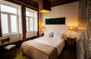 Uma cama ou camas num quarto em Casa com Historia