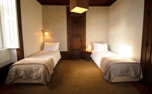 Uma cama ou camas num quarto em Casa com Historia