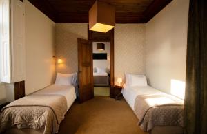 Uma cama ou camas num quarto em Casa com Historia