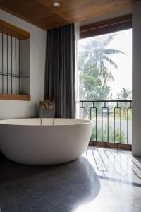 Koupelna v ubytování Hotel Gahn Khaolak