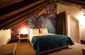 Uma cama ou camas num quarto em Casa com Historia