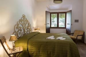 Postel nebo postele na pokoji v ubytování Agriturismo San Carlo + 37 fotografií