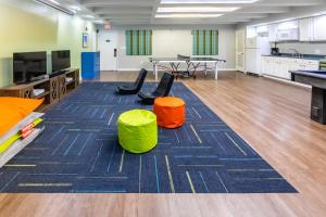 an empty classroom with two tables and two chairs at Holiday Inn Club Vacations Panama City Beach Resort in Panama City Beach