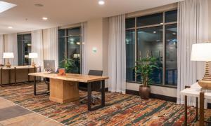an office with a desk and some windows at Holiday Inn Stevens Point - Convention Center by IHG in Stevens Point