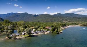 an aerial view of a resort on a river at Campeggio Conca D'Oro in Baveno