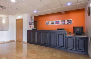 an empty waiting room with a counter in a hospital at Motel 6 Dallas – Irving DFW Airport South in Irving