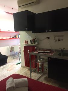 a kitchen with a sink and a counter top at Residenza Alla Piazzetta in Verona
