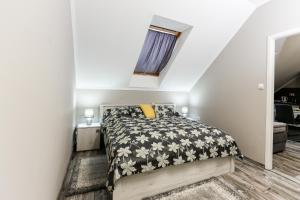 Postel nebo postele na pokoji v ubytování GÁRDI APARTMAN